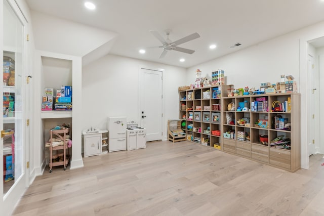 interior space with light hardwood / wood-style flooring and ceiling fan