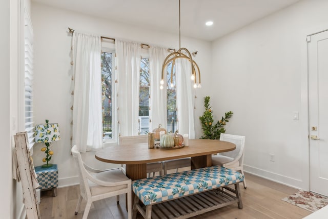 dining space featuring a healthy amount of sunlight and light hardwood / wood-style floors