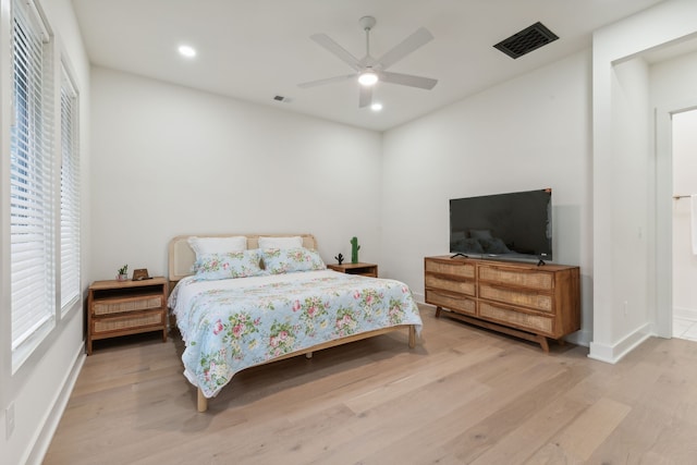 bedroom featuring light hardwood / wood-style floors and ceiling fan