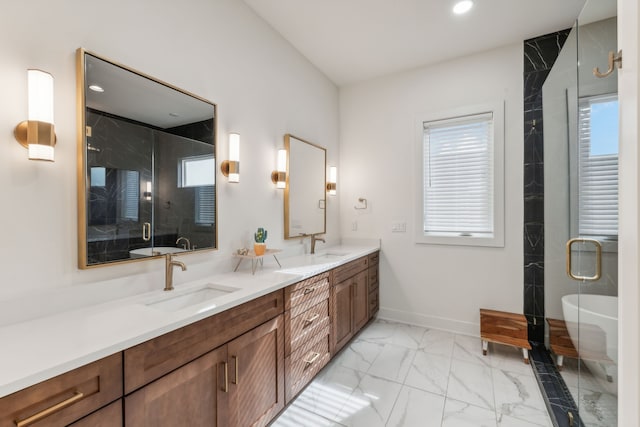 bathroom featuring a wealth of natural light, vanity, and shower with separate bathtub