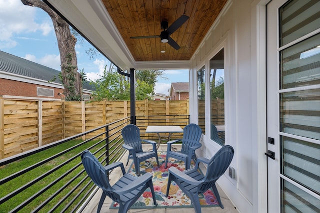 exterior space with ceiling fan