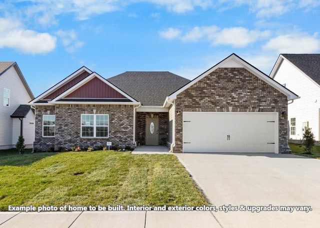 view of front of home with a garage and a front lawn