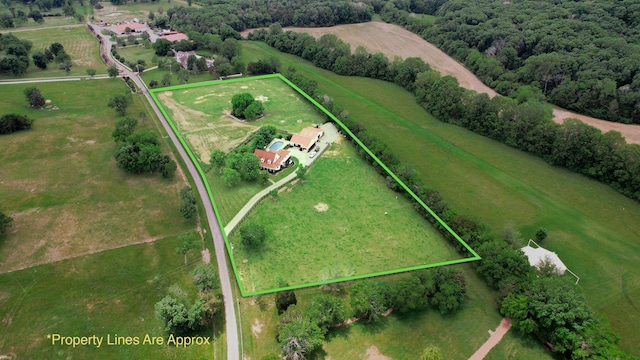 birds eye view of property featuring a rural view