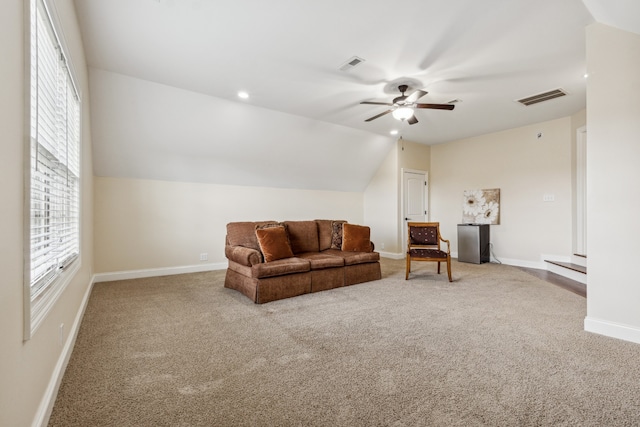 living room with carpet flooring, ceiling fan, and lofted ceiling