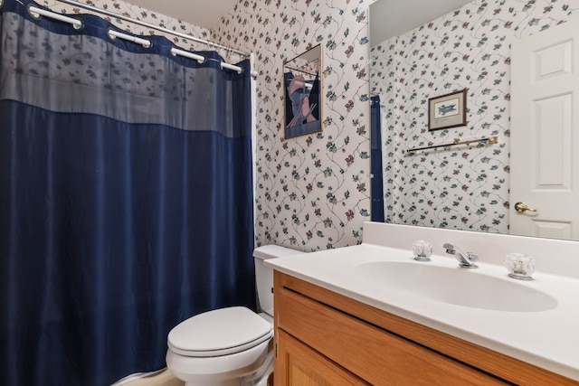 bathroom with a shower with curtain, vanity, and toilet