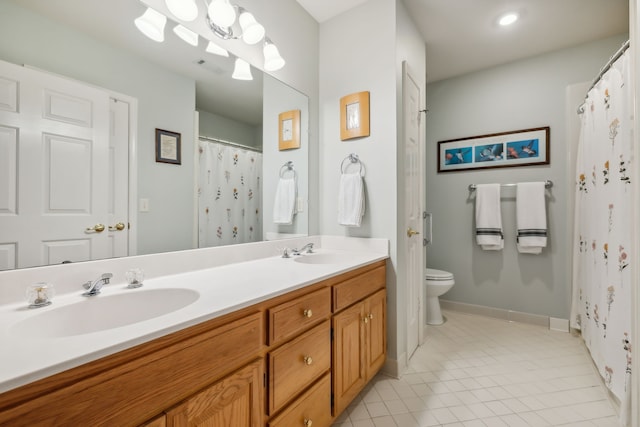 bathroom with tile patterned floors, a shower with curtain, vanity, and toilet