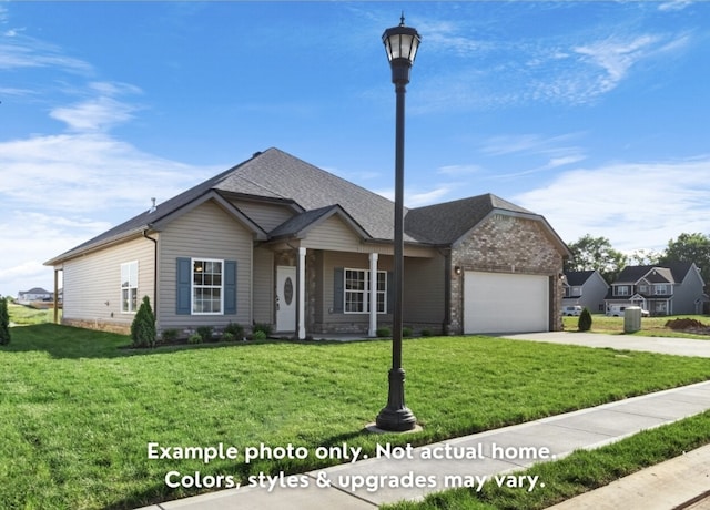 view of front of home with a garage and a front yard