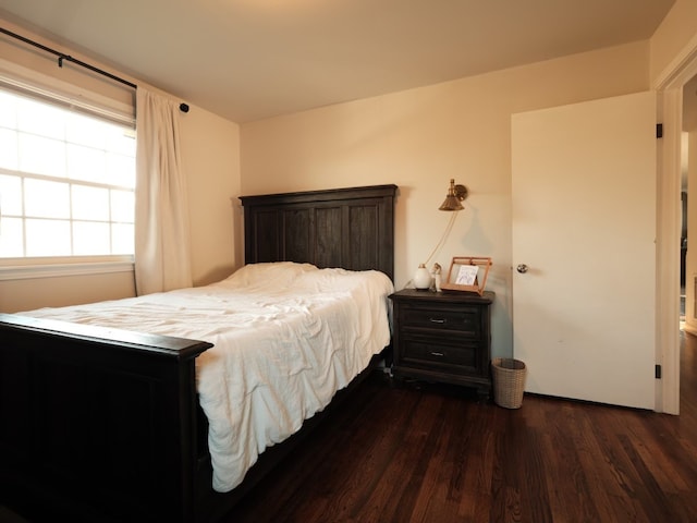 bedroom featuring dark hardwood / wood-style flooring