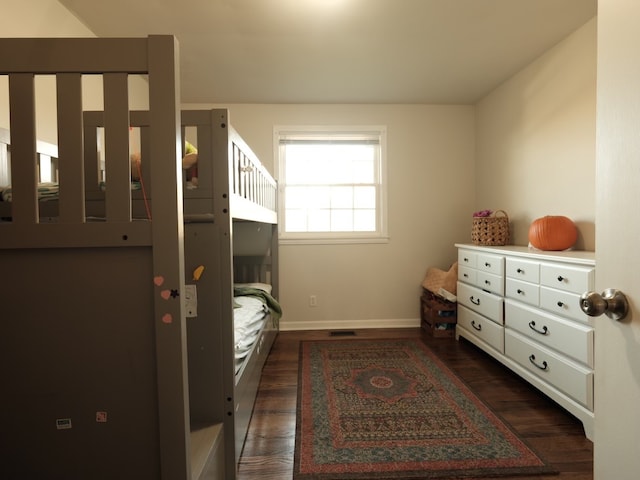 bedroom featuring dark hardwood / wood-style floors