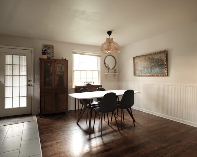 dining area with dark wood-type flooring