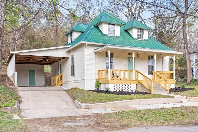 view of front of property with a carport and covered porch