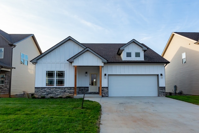 view of front of home featuring a garage and a front lawn