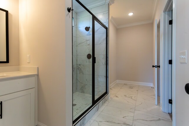 bathroom featuring vanity, crown molding, and a shower with shower door