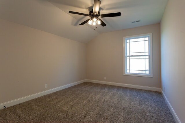 additional living space featuring carpet floors, vaulted ceiling, and ceiling fan