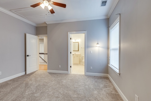 unfurnished bedroom featuring multiple windows, light carpet, and crown molding