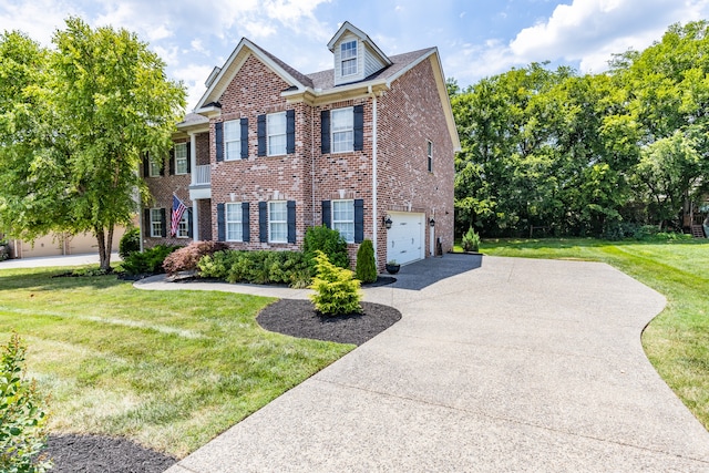 view of front of property with a front lawn and a garage