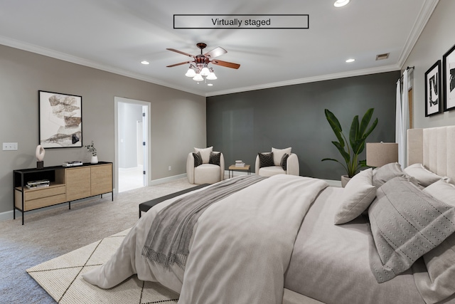 carpeted bedroom featuring ceiling fan and crown molding