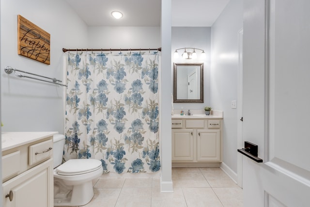 bathroom with walk in shower, tile patterned flooring, vanity, and toilet