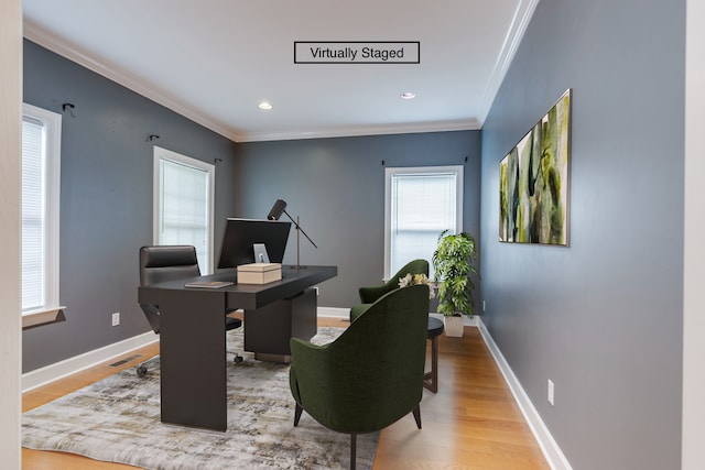 office featuring light wood-type flooring and ornamental molding