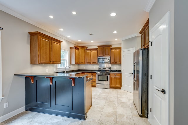 kitchen featuring a kitchen bar, stainless steel appliances, kitchen peninsula, and crown molding