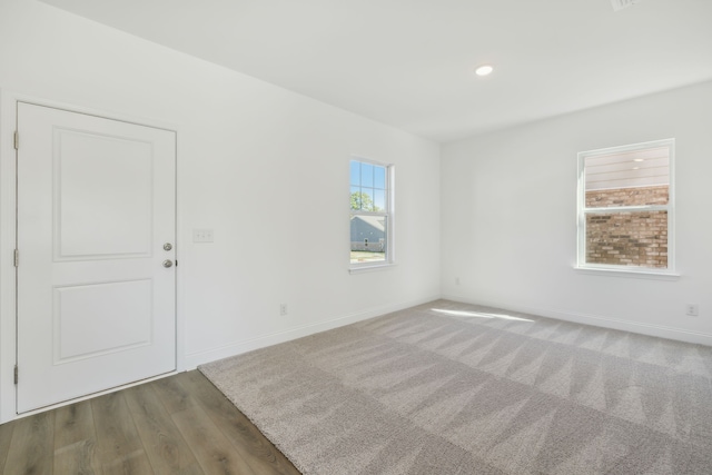 spare room with dark hardwood / wood-style floors