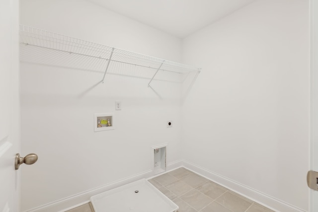 clothes washing area with washer hookup, electric dryer hookup, and light tile patterned floors