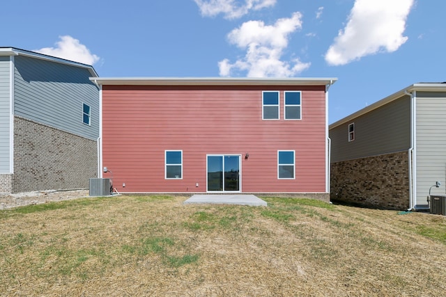 back of house featuring a patio area, a yard, and central AC unit