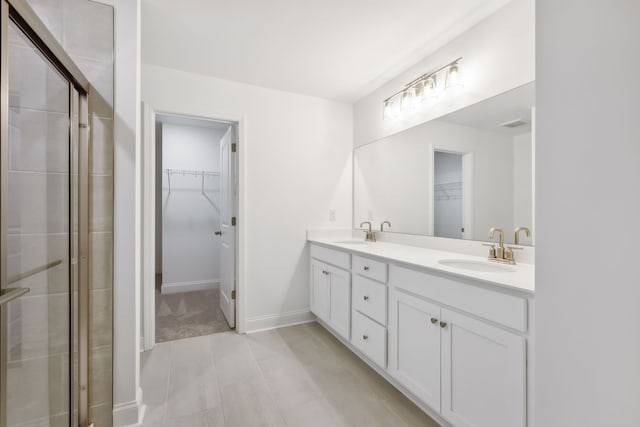 bathroom with vanity and an enclosed shower