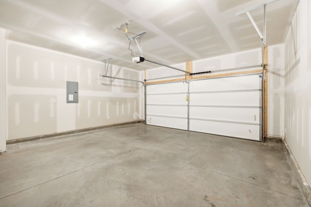 garage featuring electric panel and a garage door opener