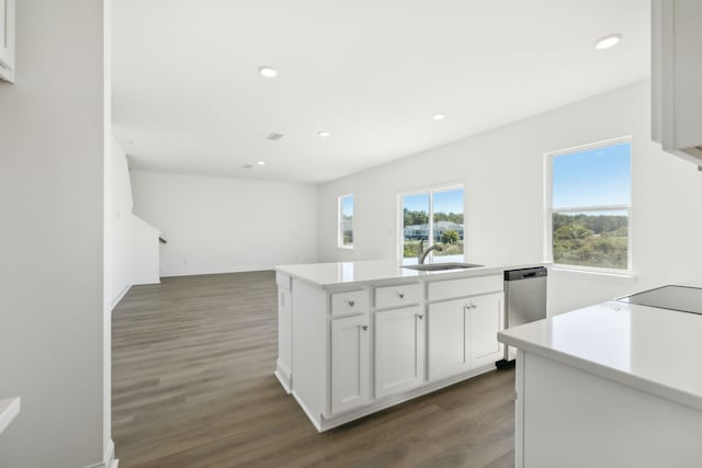 kitchen featuring dishwasher, white cabinets, sink, a kitchen island, and dark hardwood / wood-style flooring