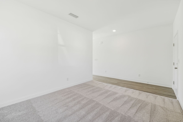 unfurnished room featuring hardwood / wood-style flooring