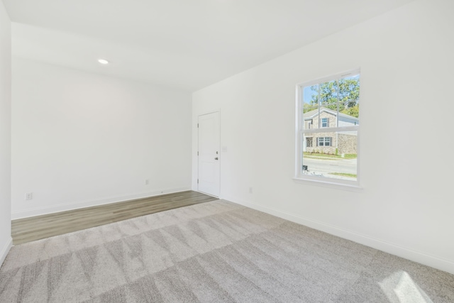 spare room featuring light wood-type flooring