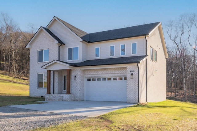 view of front of home featuring a garage and a front lawn