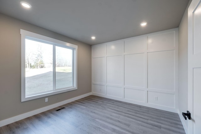 empty room featuring wood-type flooring