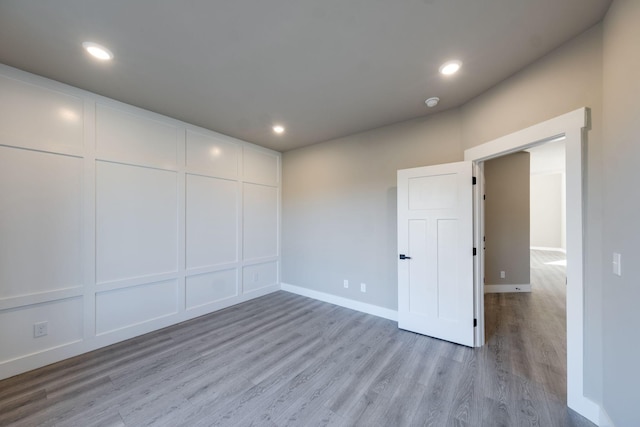 unfurnished room featuring light hardwood / wood-style floors