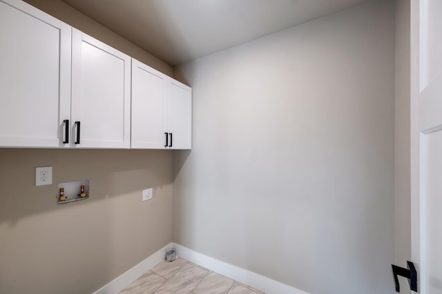 washroom featuring cabinets and washer hookup