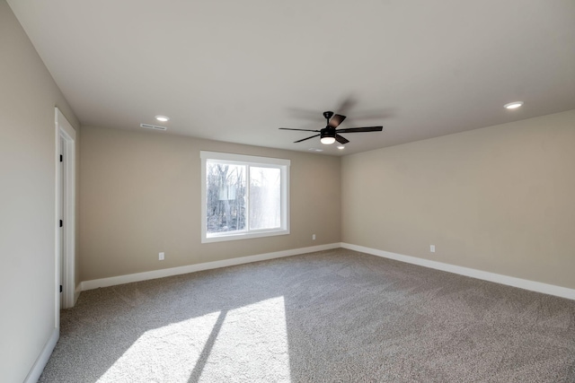 carpeted empty room featuring ceiling fan