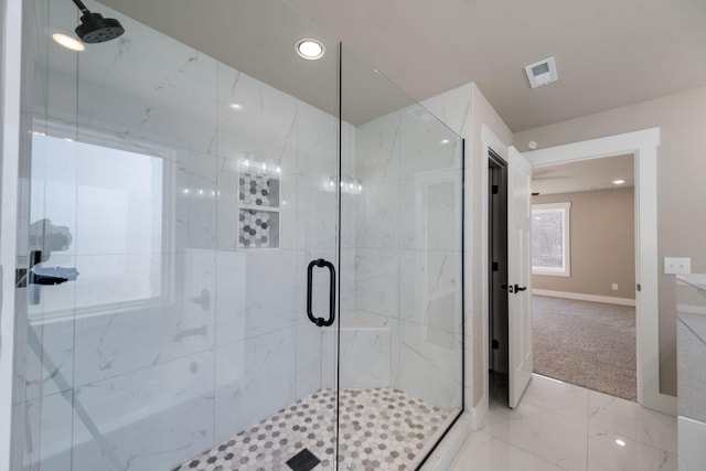 bathroom with a shower with shower door