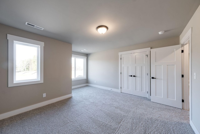 unfurnished bedroom featuring carpet flooring