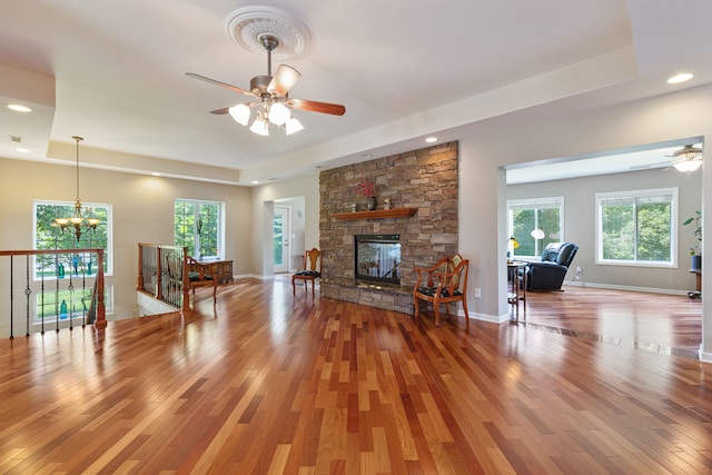 living room with a fireplace, a healthy amount of sunlight, and hardwood / wood-style flooring