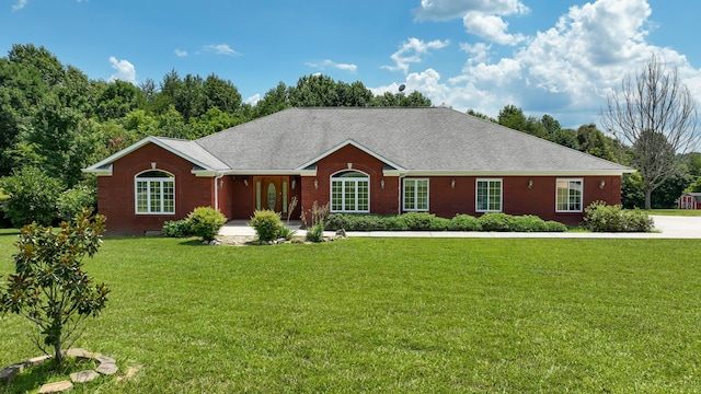single story home featuring a front yard