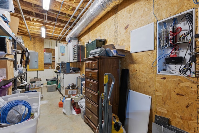 basement featuring a workshop area and electric panel