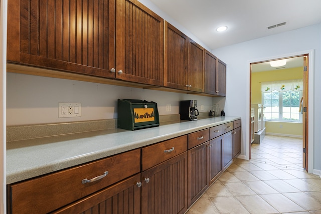 kitchen featuring light tile patterned flooring
