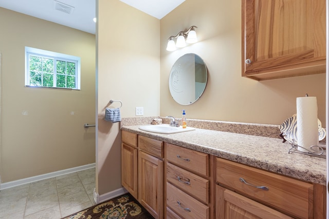 bathroom with vanity and tile patterned floors