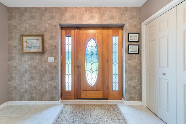entrance foyer with light tile patterned floors