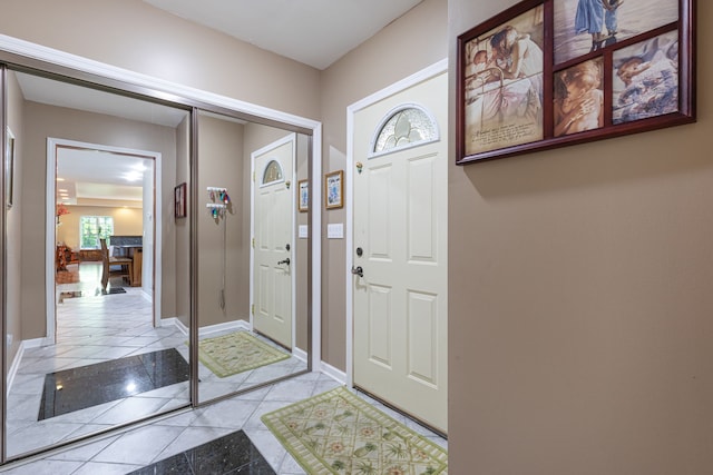 foyer entrance featuring light tile patterned floors