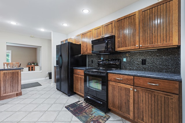 kitchen featuring black appliances, decorative backsplash, and light tile patterned flooring