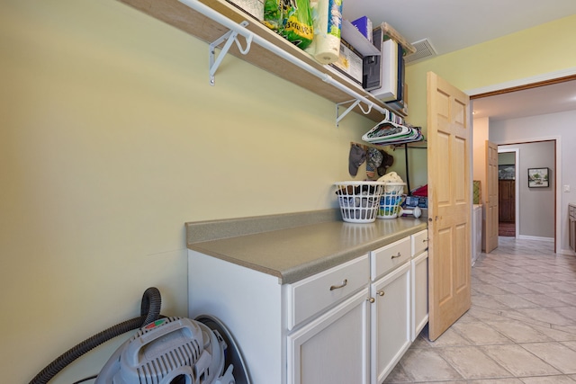 laundry room with light tile patterned floors