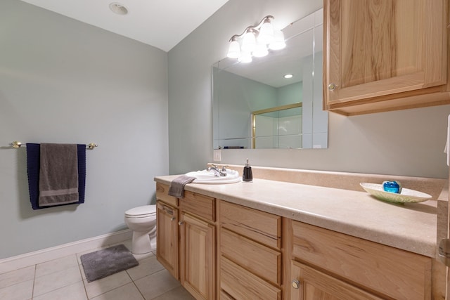 bathroom with tile patterned flooring, vanity, toilet, and an enclosed shower