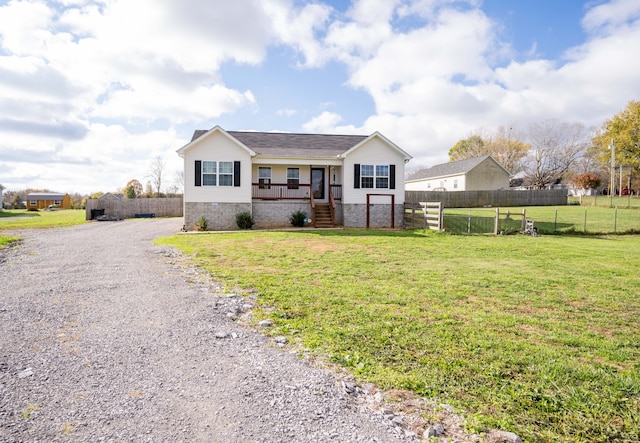 view of front of property featuring a front lawn and a porch